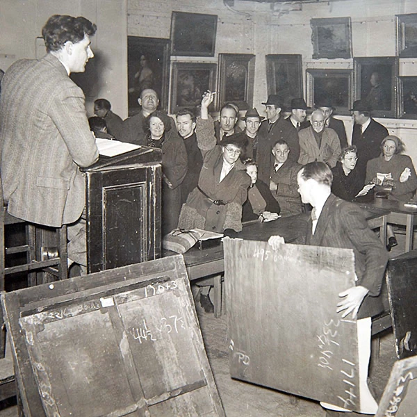 Ted Everett taking a picture auction for Bonhams in the 1950s
