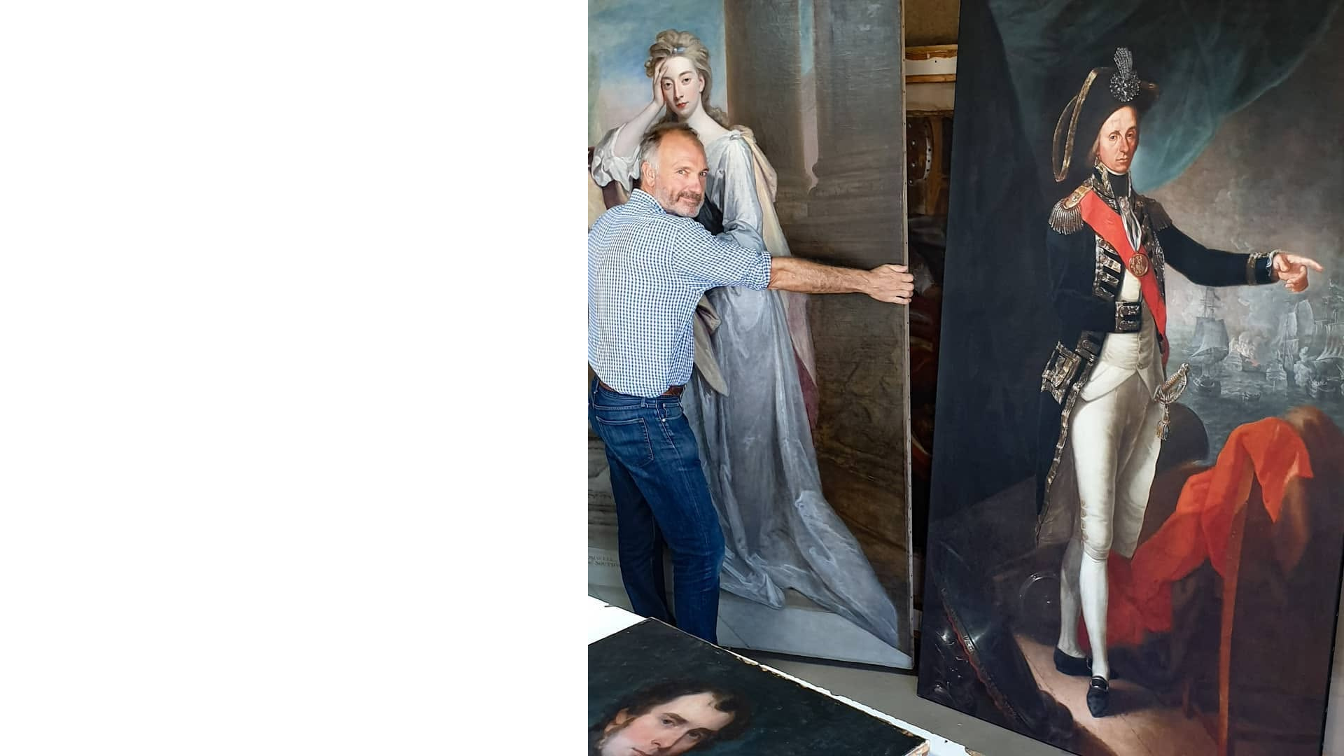 Conservator's hand delicately retouching a historic painted map with a fine brush
