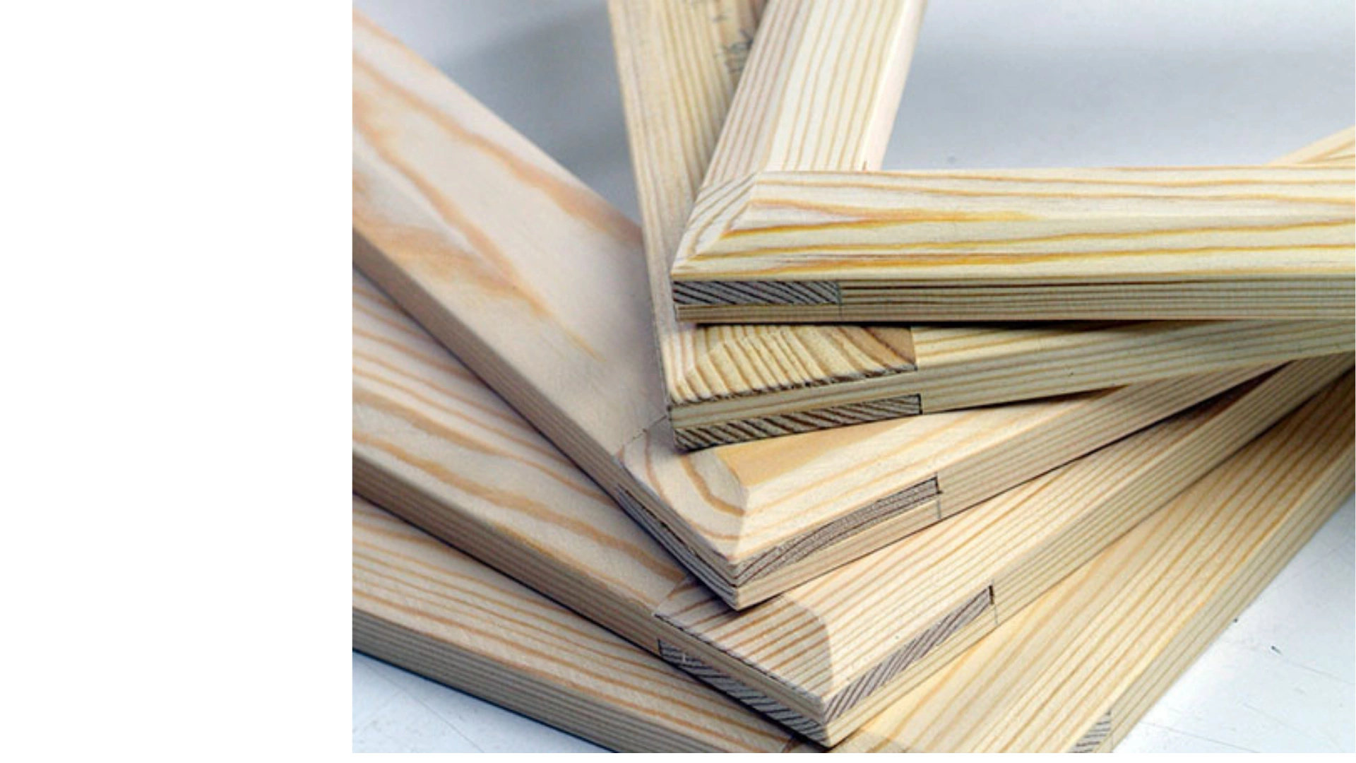 Close-up of hand-crafted joinery on a wooden stretcher frame in the workshop