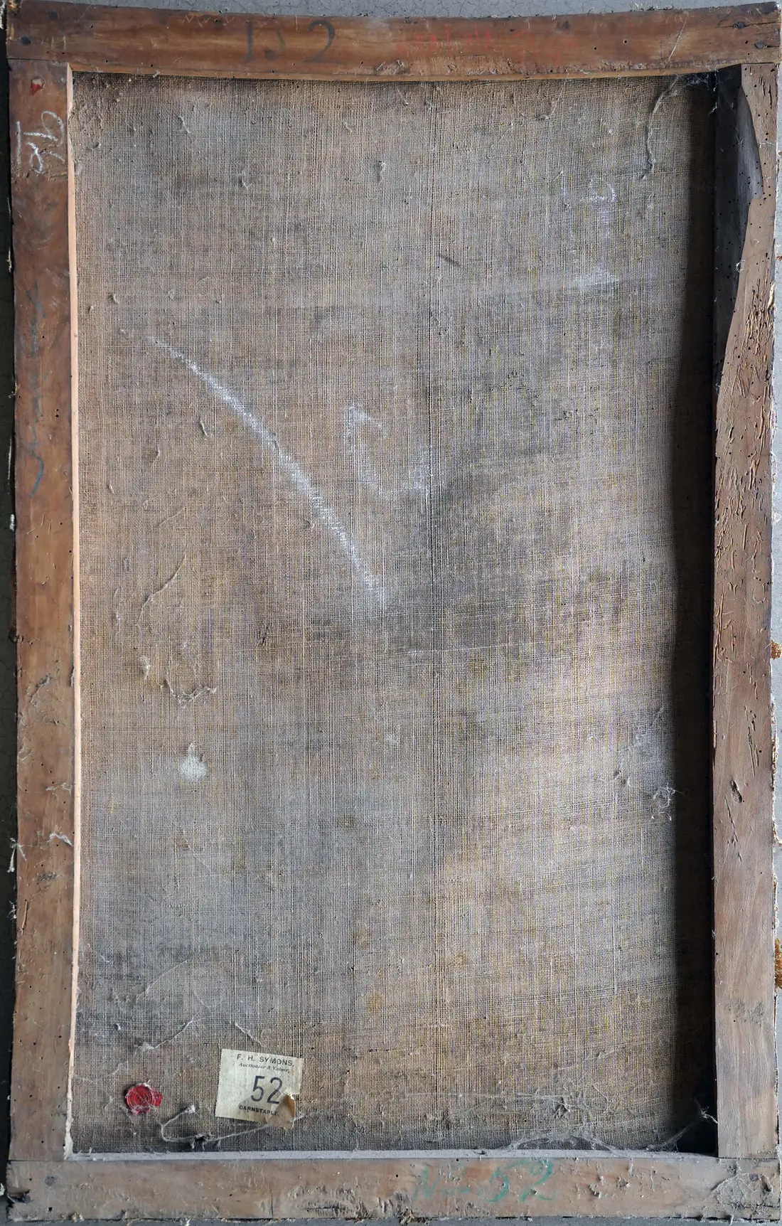 The reverse of the canvas, showing an early auctioneer's label from F. H. Symons of Barnstaple