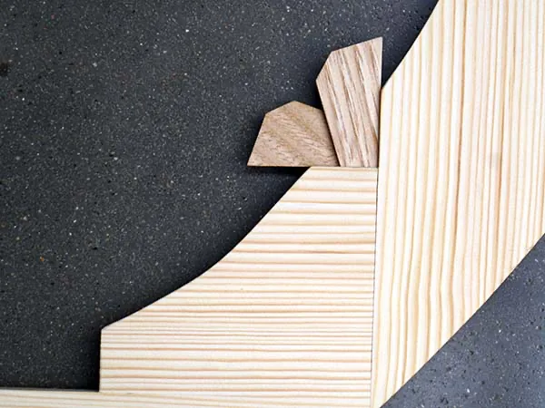 Close-up of a hardwood corner key set into a mitred stretcher joint