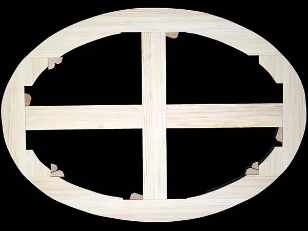 A bespoke oval stretcher frame with cross-bracing and hardwood corner keys