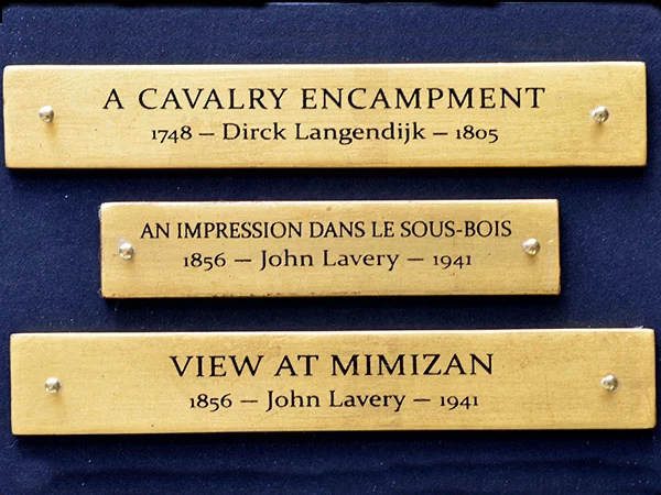 Rows of finished gold leaf plaques bearing artists' names